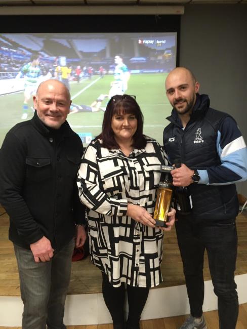 Nick receives his memento for 150 matches from Ieuan Evans and Wendy Rossiter
