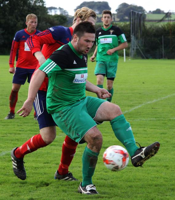 Adam Raymond holds off the defender to set up another  attack for Goodwick