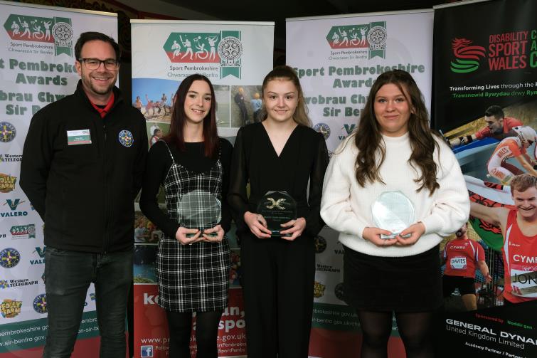 Girls (U16) Sporting Achievement - Pictured is winner Gracie Griffiths with finalists Chloe John-Driscoll and Grace Morris, with Toby Ellis from Pure West Radio. 