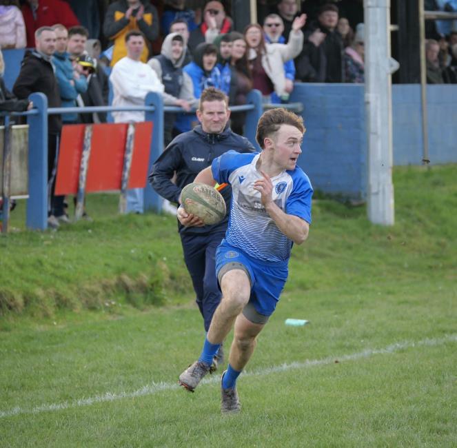  Jack Evans pounces for a try  for The Blues, to their supporters delight. Picture William John
