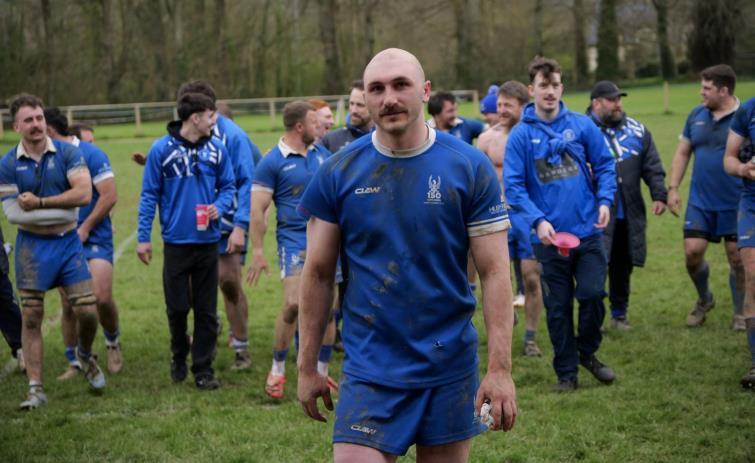 MoM James Hart leads a delighted Blues team off the pitch. Picture William John