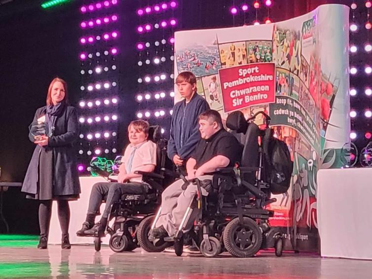 Lewis Crawford on the stage at the Sport Pembrokeshire Awards