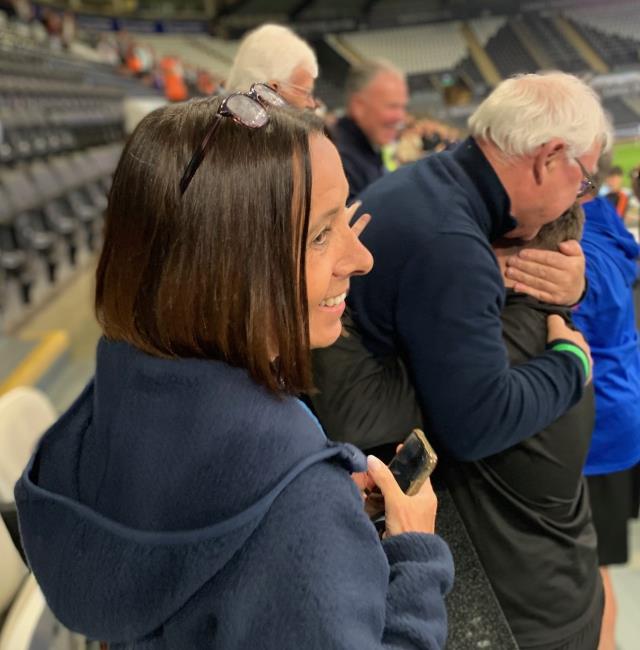 Sheer delight as Chris Tansey hugs Scott Davies. Karen Fawcett looks on.