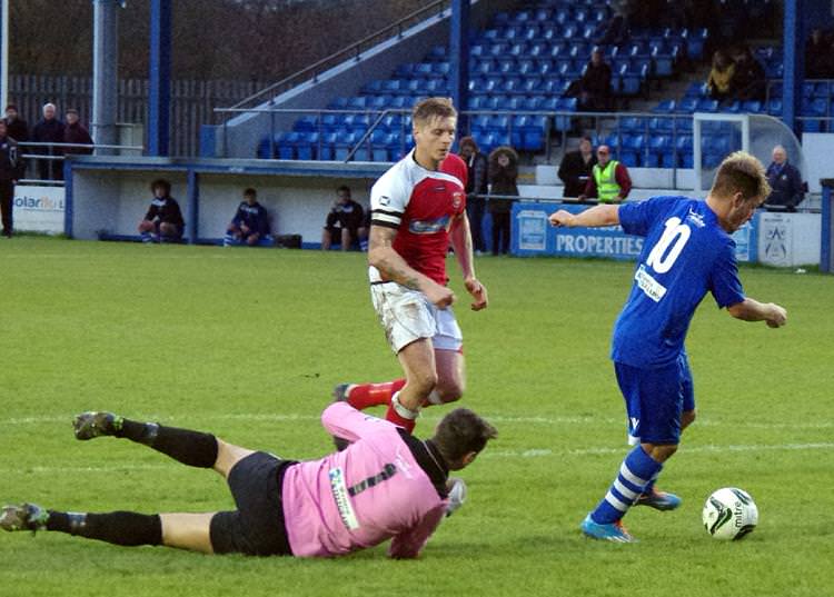 Jordan Follows goes around Penybont keeper Chris Curtis to give his side the lead
