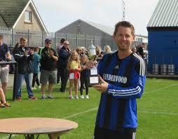 Ewan Findlay receives Joe Lennon Memorial trophy