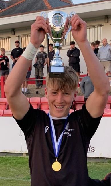  Josh James raises the trophy