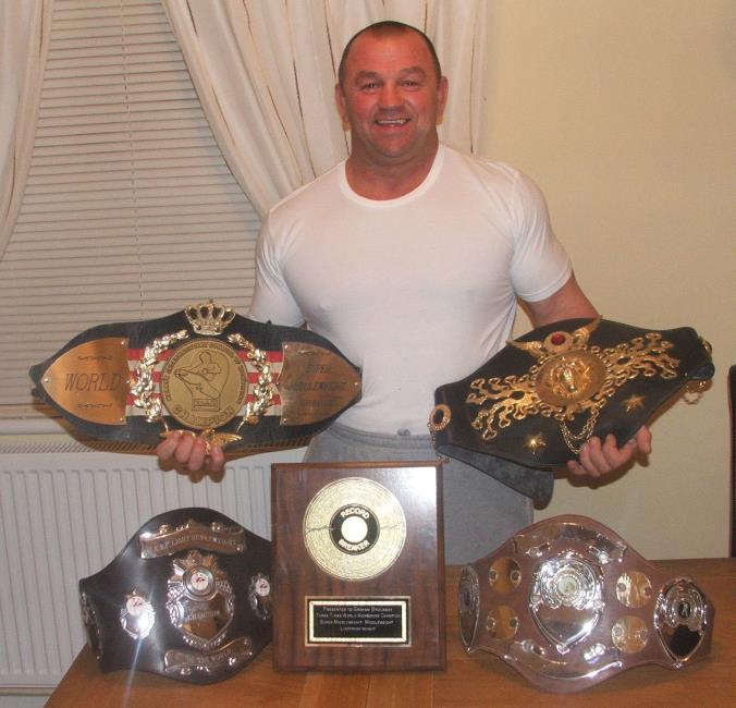 Graham Brockway and his kick boxing belts
