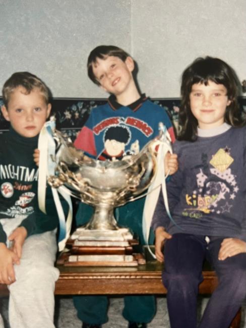 Lucy and brothers holding The Bowl