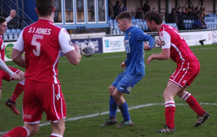 Danny Williams surrounded by Lakesiders defenders