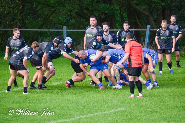 Iori Curtis on a charge for The Blues. Picture William John