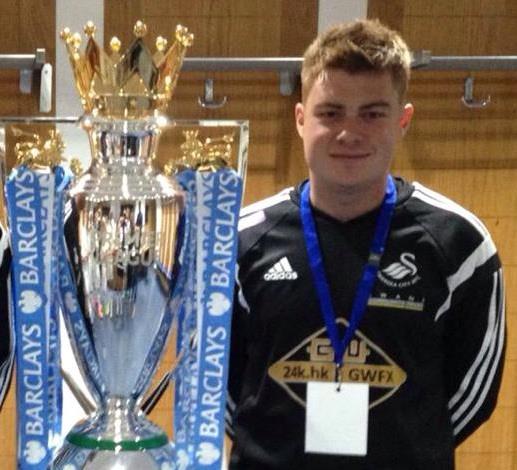 Ceri Phillips poses with the Premier League Trophy