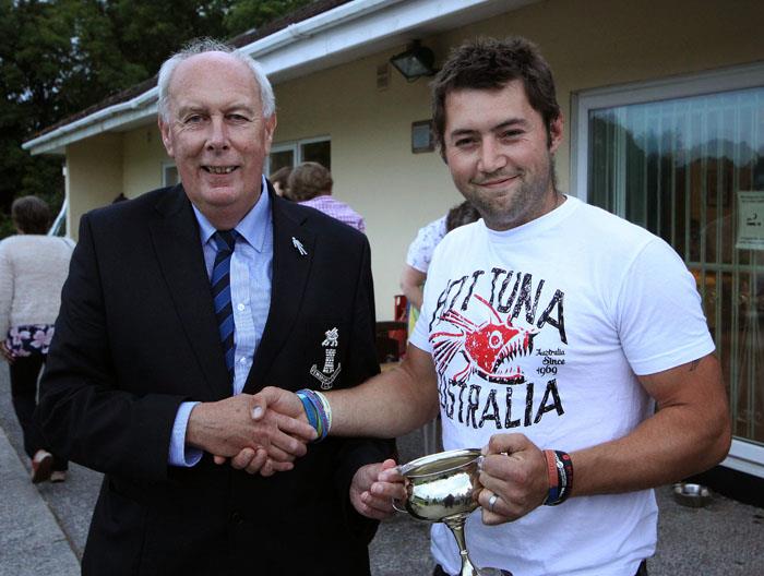 Ross Hardy (Kilgetty) receives the Division Two silverware from county club chairman Tony Scourfield