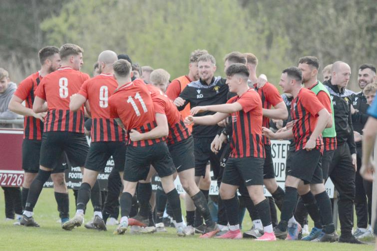 Goodwick United players celebrate the opening goal against Hakin United