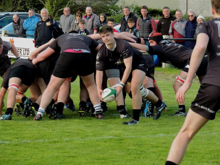 George Evans gets the ball away