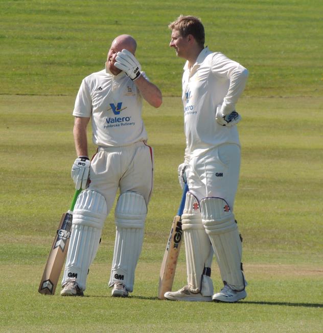 David Blackwell and Peter McGilloway take a deserved breather in their 150 stand for Lamphey