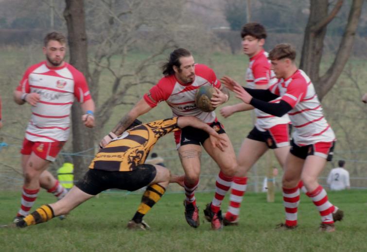 Milford centre Dan Birch surges forward