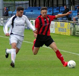 Jonny Horgan is closely marked by Ross Lascelles