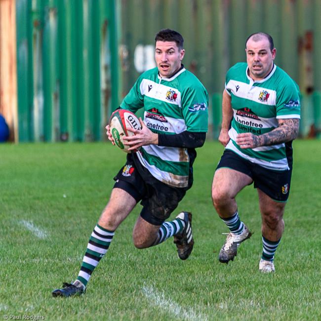 Johnny Thomas races clear for Whitland with Marc Jones in support