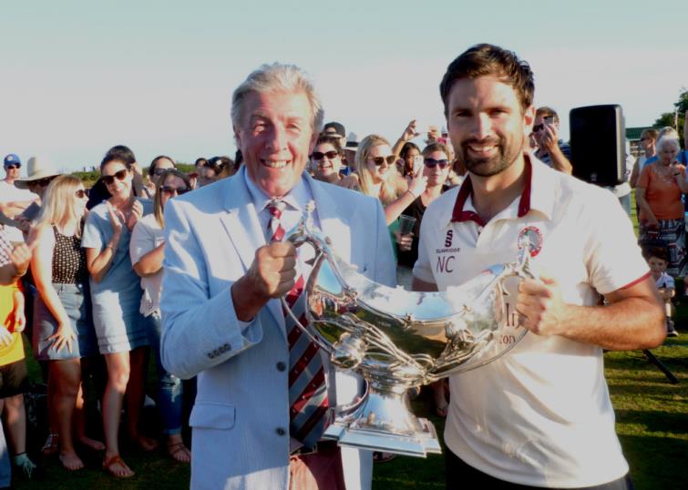 Cresselly captain Neilson Cole receives the Bowl from Hugh Harrison-Allen
