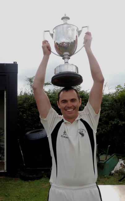 Sean Hannon raises the trophy   aloft