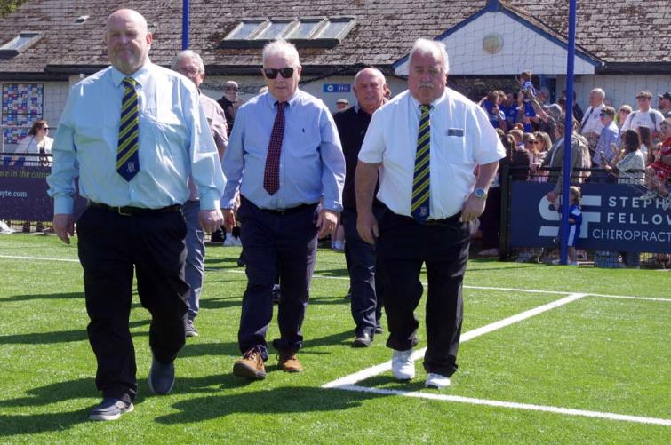 Pembrokeshire Football League officials lead both sides out